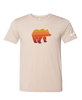 Striped bear graphic featured on tan shirt.